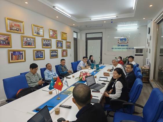 A group of people sitting around a long table

AI-generated content may be incorrect.